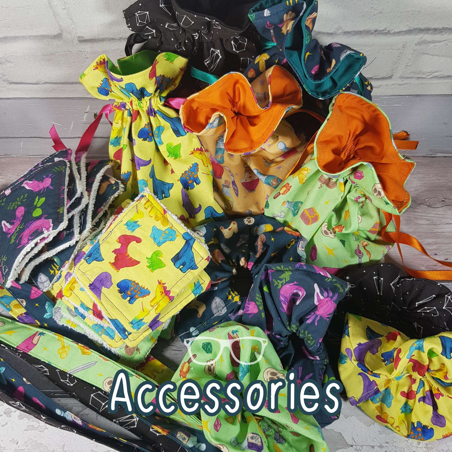 A collection of accessories including, drawstring bags, facewipes, scrunchies and lanyards