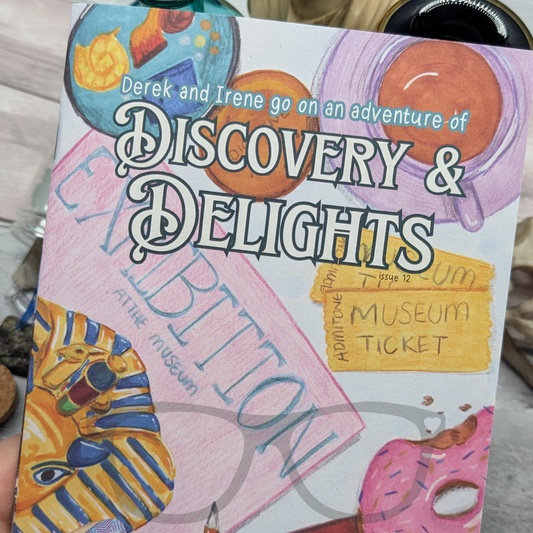 Children's zine titled 'Discovery & Delights' with colourful illustrations on a wooden surface. The zine features a much longer story, an article, activity pages and a special comic by This Goblin Makes
