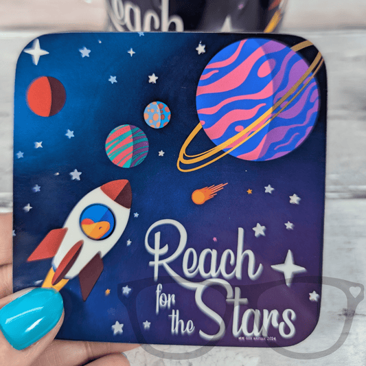 Space-themed hardwood coaster for drinks featuring Derek the stegosaurus and "Reach for the Stars" text, Mini Geek Boutique