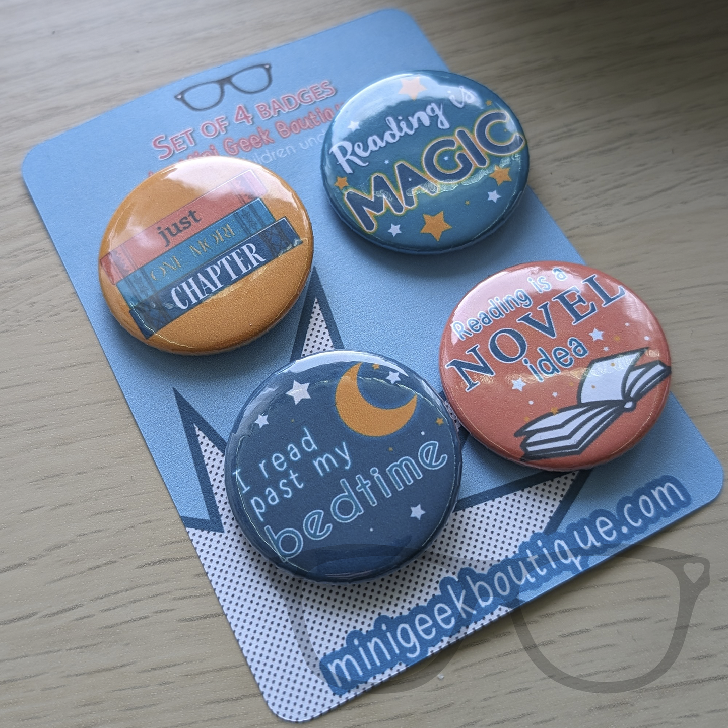 Set of 4 38mm badges ideal for lovers of books and reading. Text reads "Reading is a novel idea", "Reading is magic", "I read past my bedtime",  "Just one more chapter"