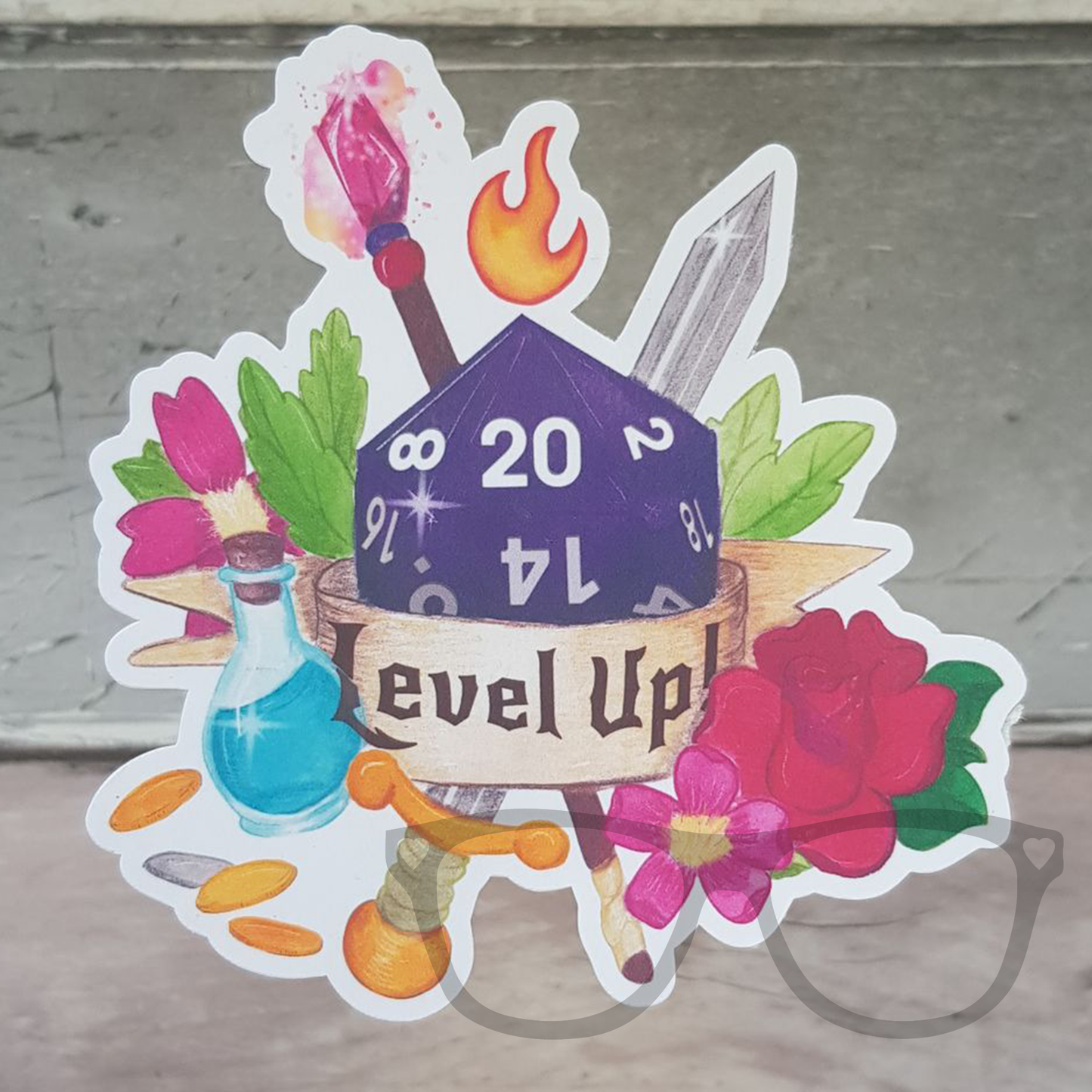 Level up with this glossy vinyl sticker. A purple dice surrounded by items you'd find when playing tabletop fantasy RPGs and a ribbon with the words "Level Up!" written on it.