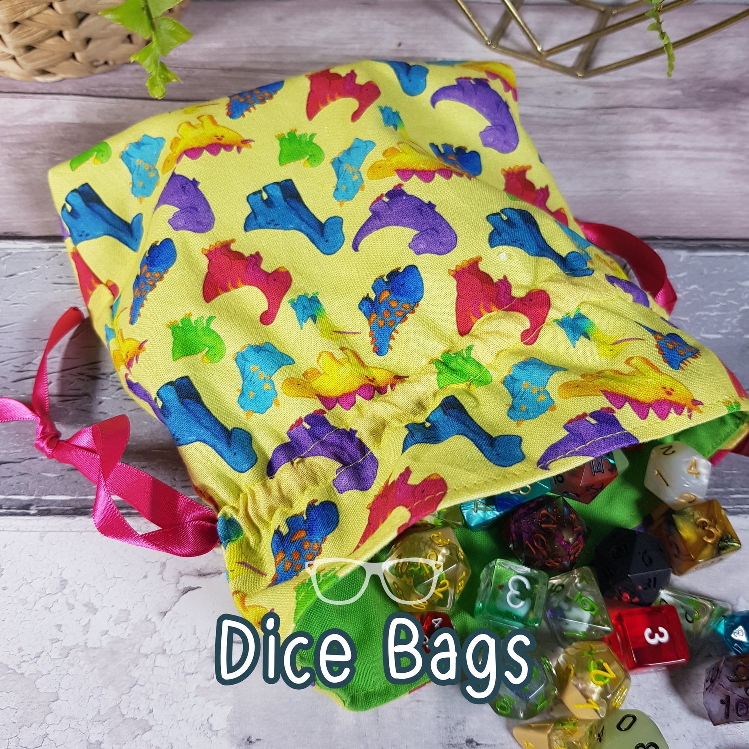Dice bags with all sorts of themes, the bag shown has dinosaurs