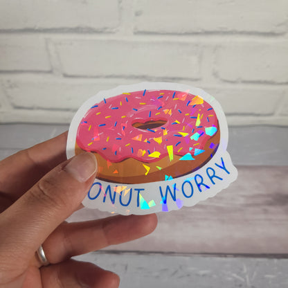 Donut Worry Sticker, sparkly pink donut sticker with the text "Donut Worry" underneath