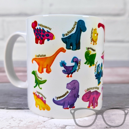 white ceramic mug with vibrant illustrations of dinosaurs for every letter of the alphabet