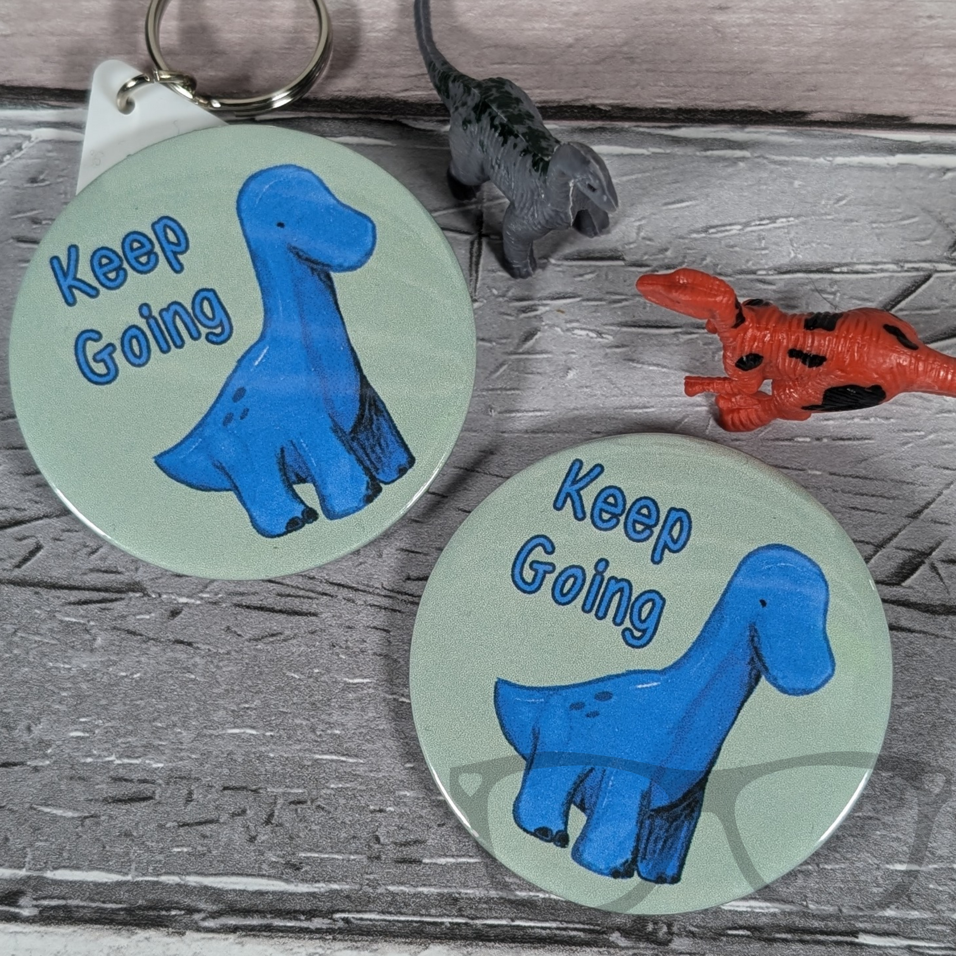Brenda 'Keep Going' keyring for dinosaur-loving geeky parents, showcasing the fun design.