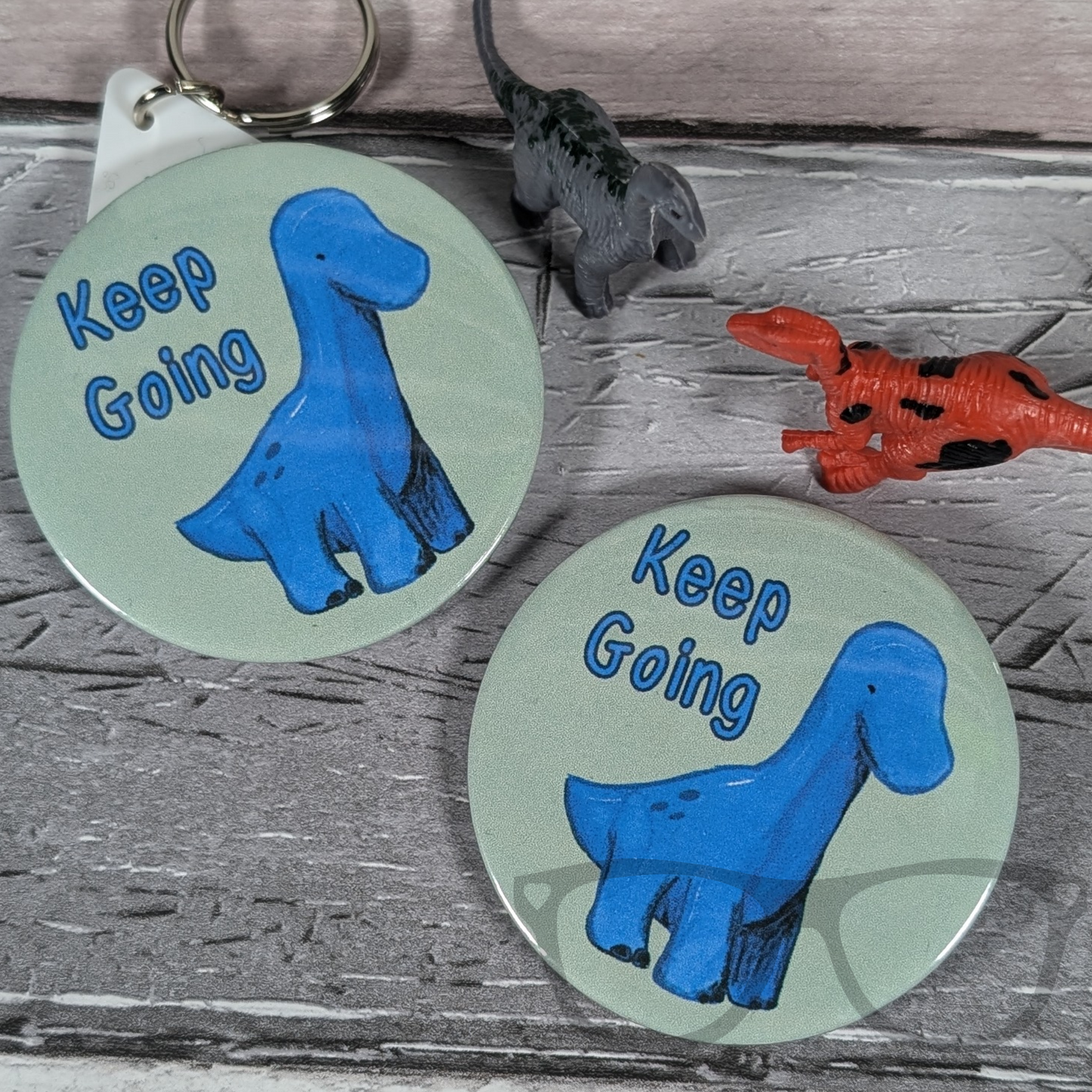 Brenda the Brachiosaurus Keep going Keyring and badge