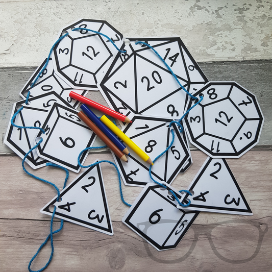 Colour-in polyhedral dice bunting kit featuring all dice types for tabletop gaming, including d20, d12, and more. Perfect for creative fun and decoration.