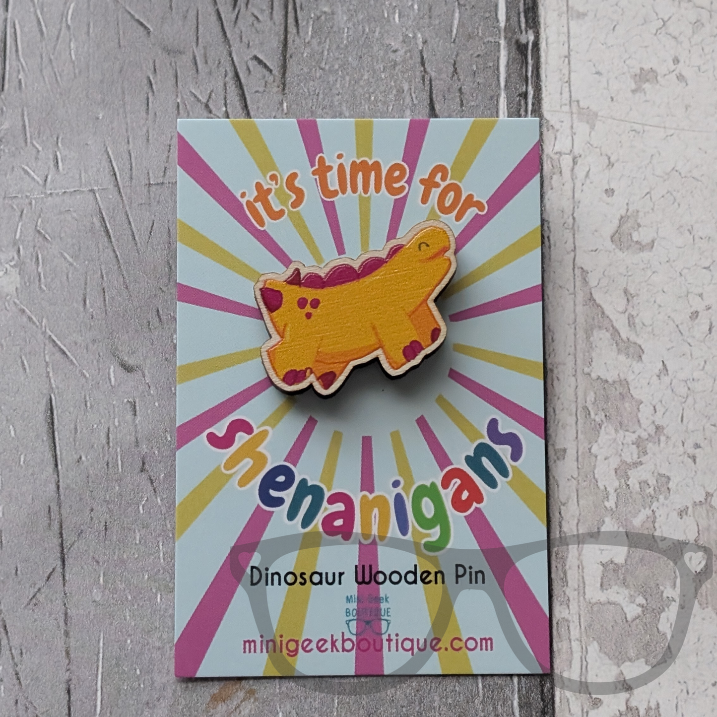Derek the stegosaurus wooden pin on It's time for shenanigans backing card