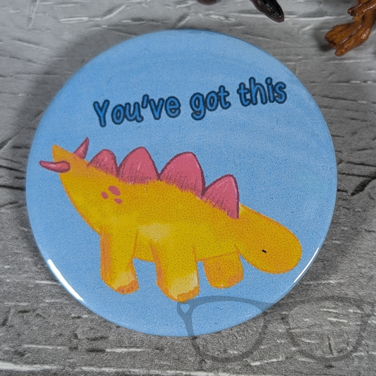 Derek "You've Got This" Dinosaur 58mm Badge with motivational text, featuring a cute dinosaur design, ideal for gifts or a confidence boost.