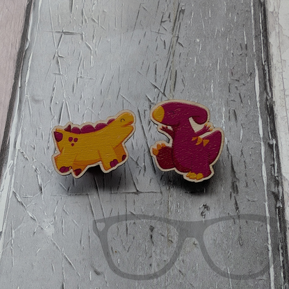 Derek the stegosaurus and Irene the Parasaurolophus wooden pin pair