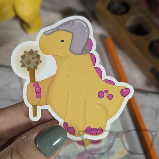 Derek the Cleric Stegosaurus vinyl sticker being held