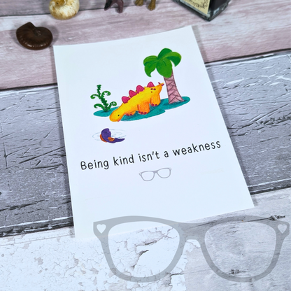 A6 dinosaur postcard with the text "Being kind isn't a weakness" 