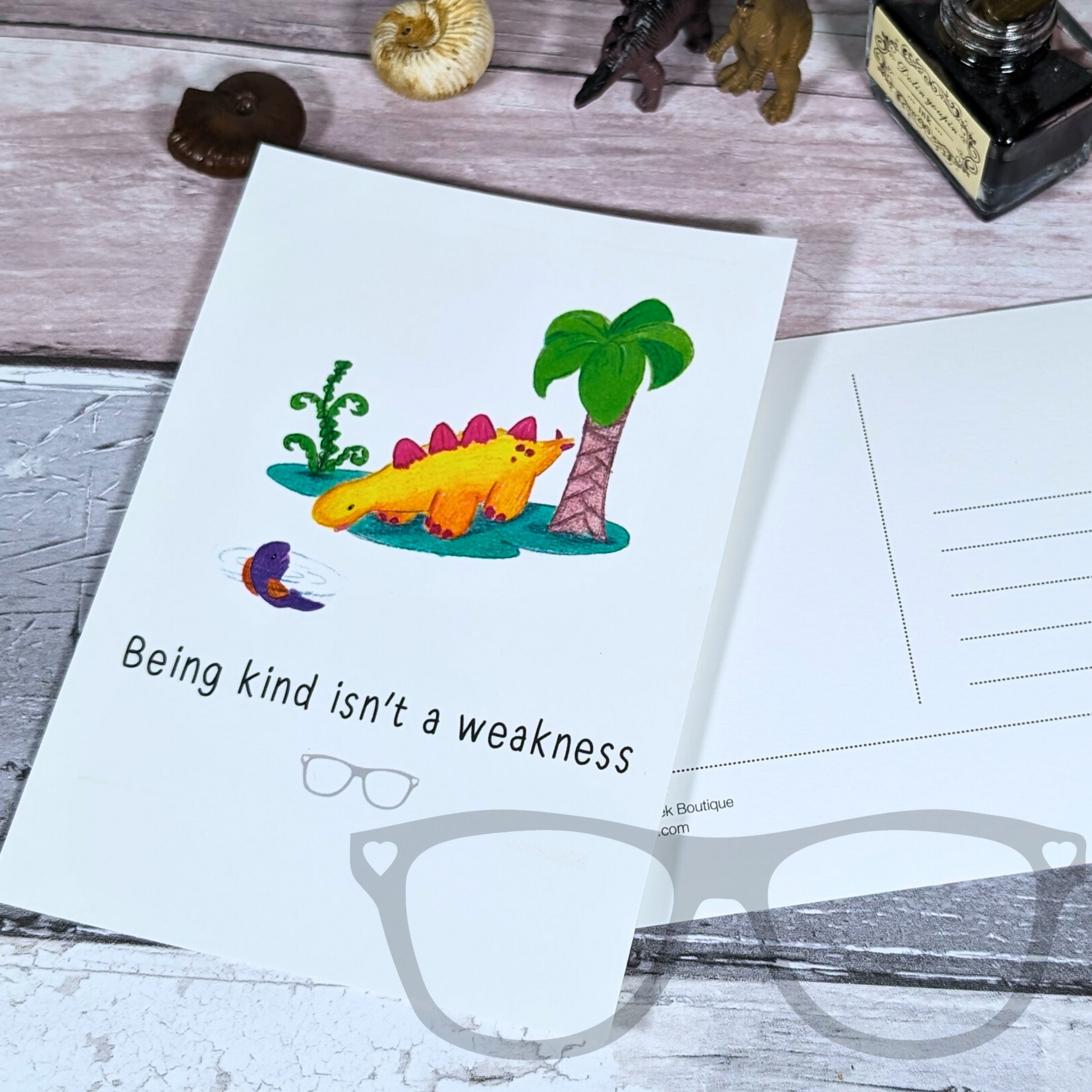 Dinosaur Postcard featuring a fun illustration and the text "Being kind isn't a weakness"