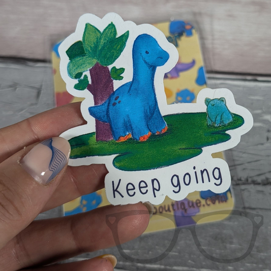 Brenda the Brachiosaurus 'Keep Going' motivational vinyl sticker with vibrant colours. Perfect for laptops and water bottles