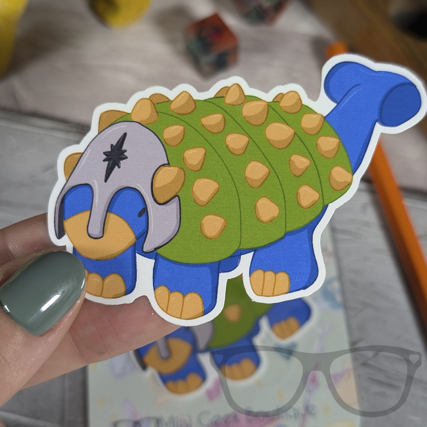 Hank the Tank Paladin Ankylosaurus vinyl sticker being held