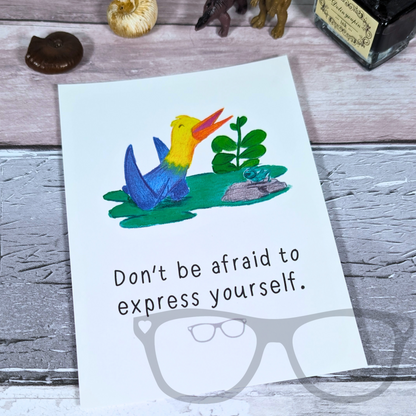 Dinosaur postcard with motivational message "Don't be afraid to express yourself"