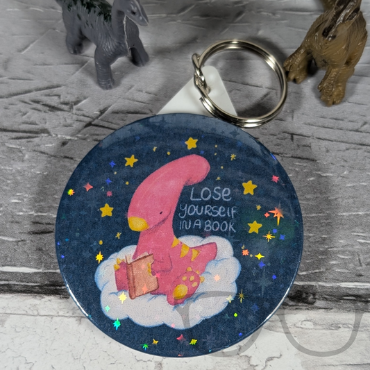 Irene the Dinosaur 'Lose Yourself in a Book' keyring with sparkly overlay