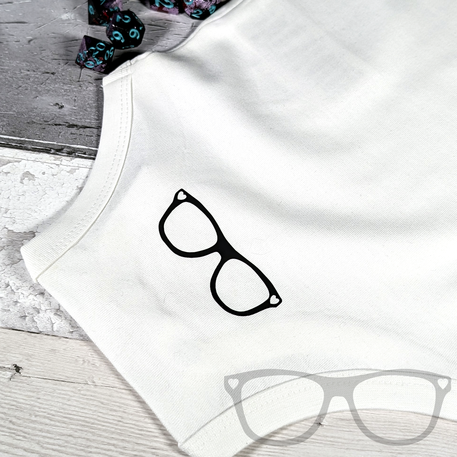 Level 1 Human organic cotton baby suit, white babysuit with black text Detail showing the back with the MGB logo