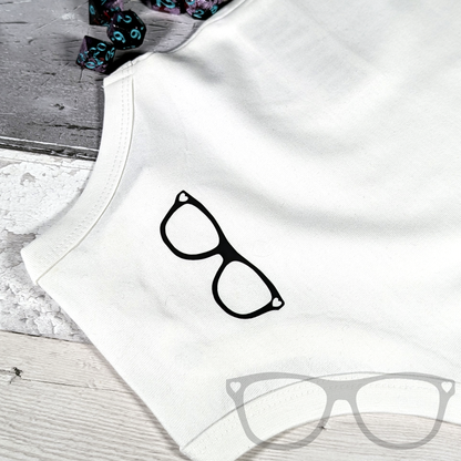 Level 1 Human organic cotton baby suit, white babysuit with black text Detail showing the back with the MGB logo
