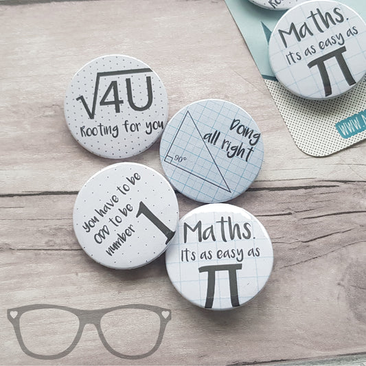 Close-up of a 38mm Math Pun Badge, showing sharp pin and Mylar protective layer.
