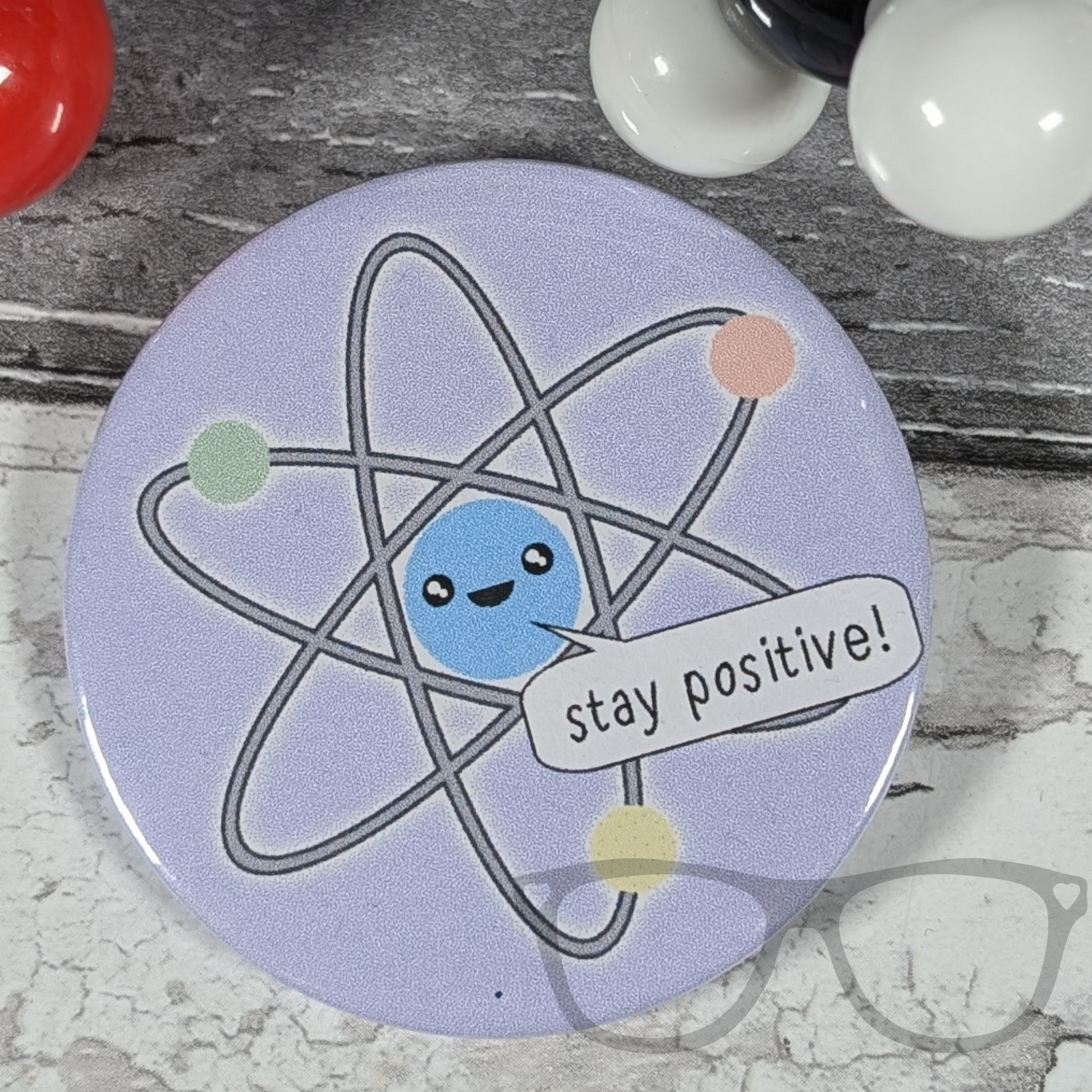 Stay positive atomic science badge