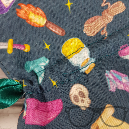 Close up showing details of the teal drawstring bag