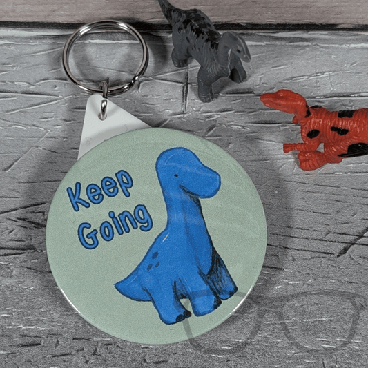 Brenda "Keep Going" 58mm Badge or Keyring – A Motivational Accessory - Mini Geek Boutique
