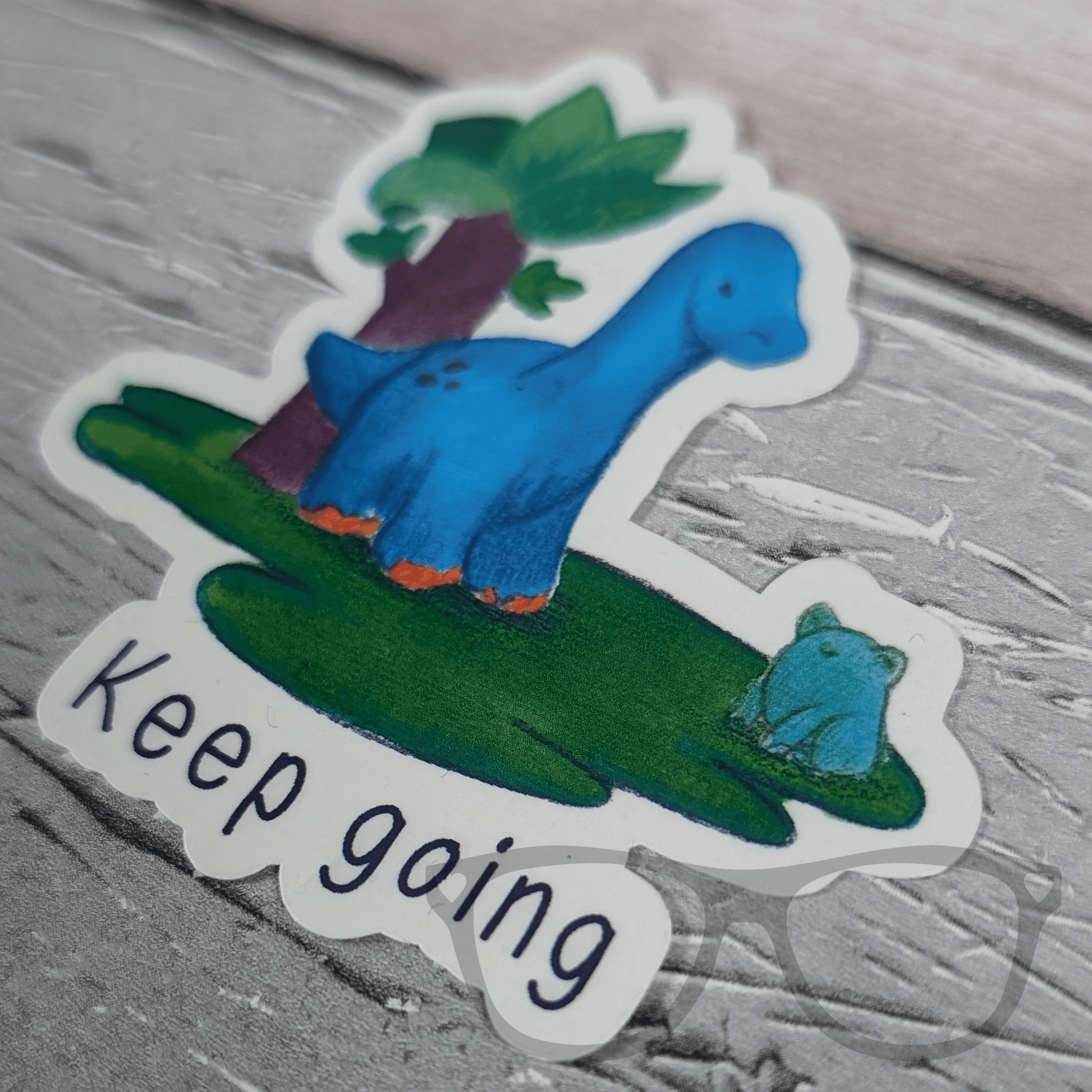 Mini Geek Boutique vinyl sticker with Brenda the brachiosaurus dinosaur and inspirational message "Keep Going"