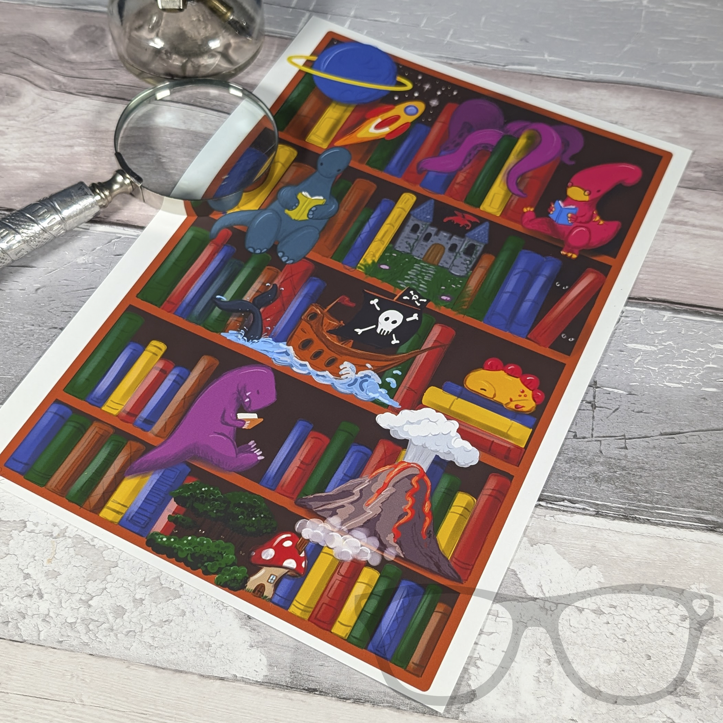 Flat lay showing dinosaurs reading in a magic library