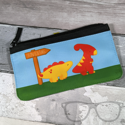 Adventure pencil case featuring an illustration of Derek the Stegosaurus and Irene the Parasaurolophus starting a new adventure, ideal for any fans of dinosaurs