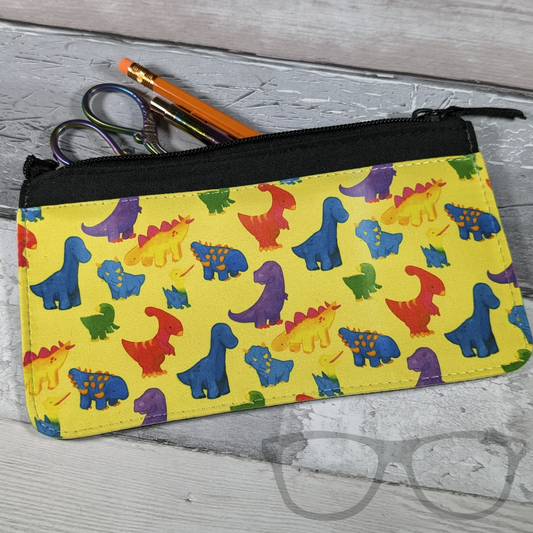 dinosaur pencil case- colourful dinosaurs on a yellow background (contents not included)