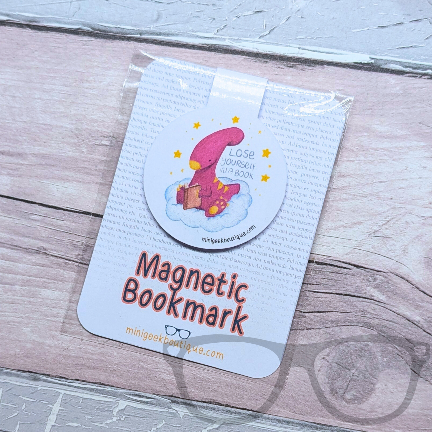 Magnetic fold-over bookmark with a laminated finish, featuring Irene the Parasaurolophus. Keeps your page marked in your favourite books without damaging pages.