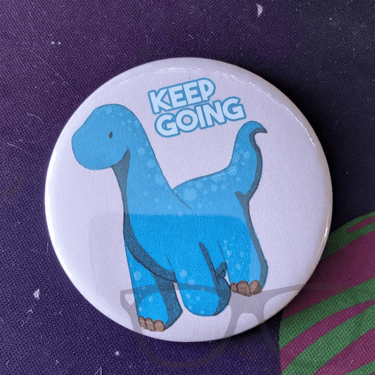 Keep Going Dinosaur badge, keyring or magnet - Mini Geek Boutique
