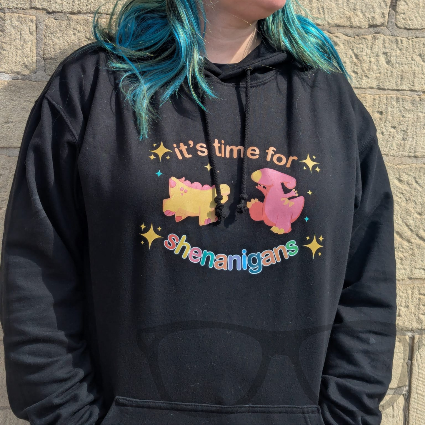 Black hoodie with 'It’s Time for Shenanigans!' dinosaur design featuring Derek and Irene