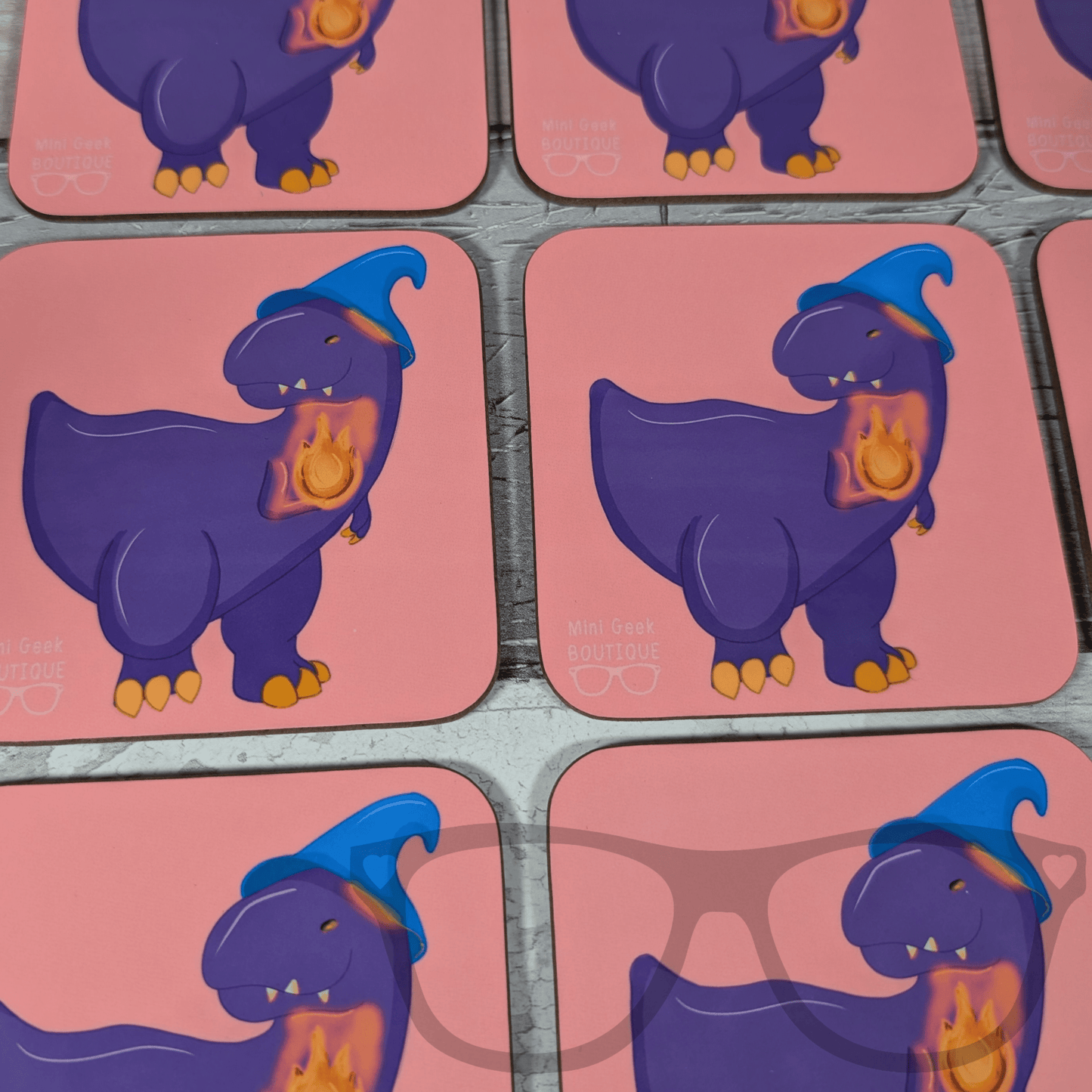 DnD-inspired drink coaster showing Mr Bolan the purple T. Rex as a wizard with blue hat and flame, Mini Geek Boutique