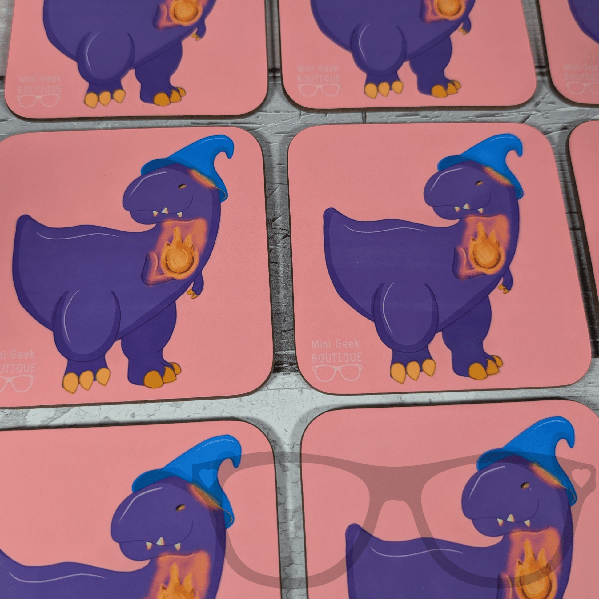 DnD-inspired drink coaster showing Mr Bolan the purple T. Rex as a wizard with blue hat and flame, Mini Geek Boutique