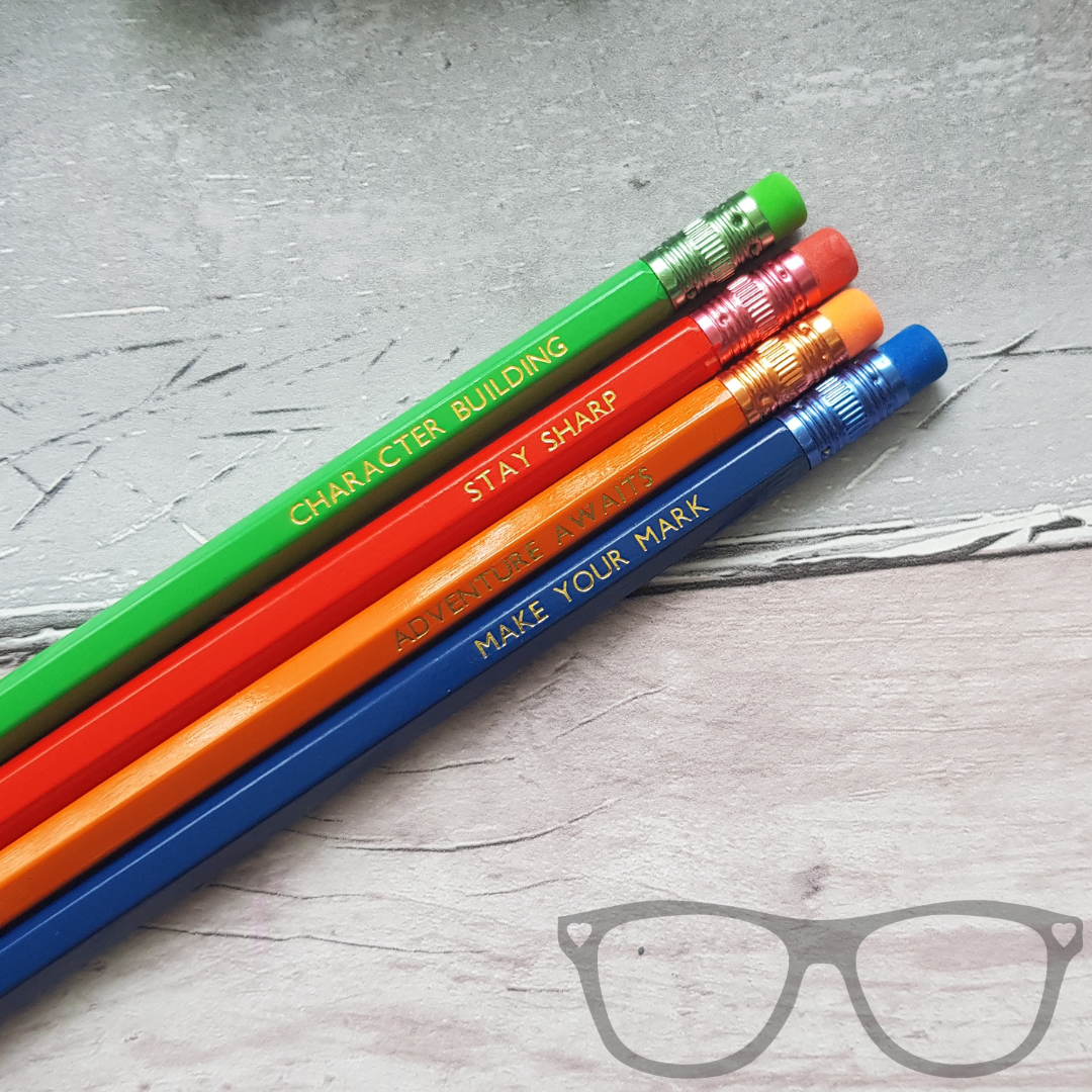 Set of 4 2B pencils with text. Character building, stay sharp, adventure awaits, make your mark. 