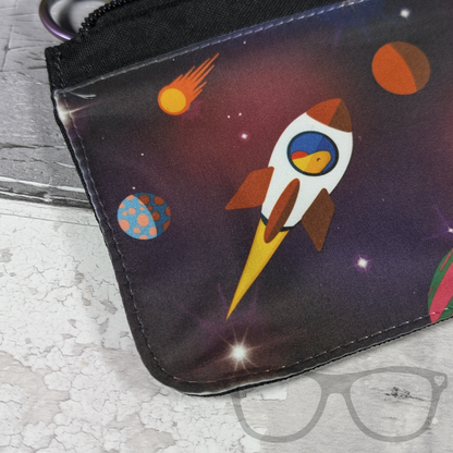 Close up detail of reach for the stars pencil case showing a dinosaur in a rocket