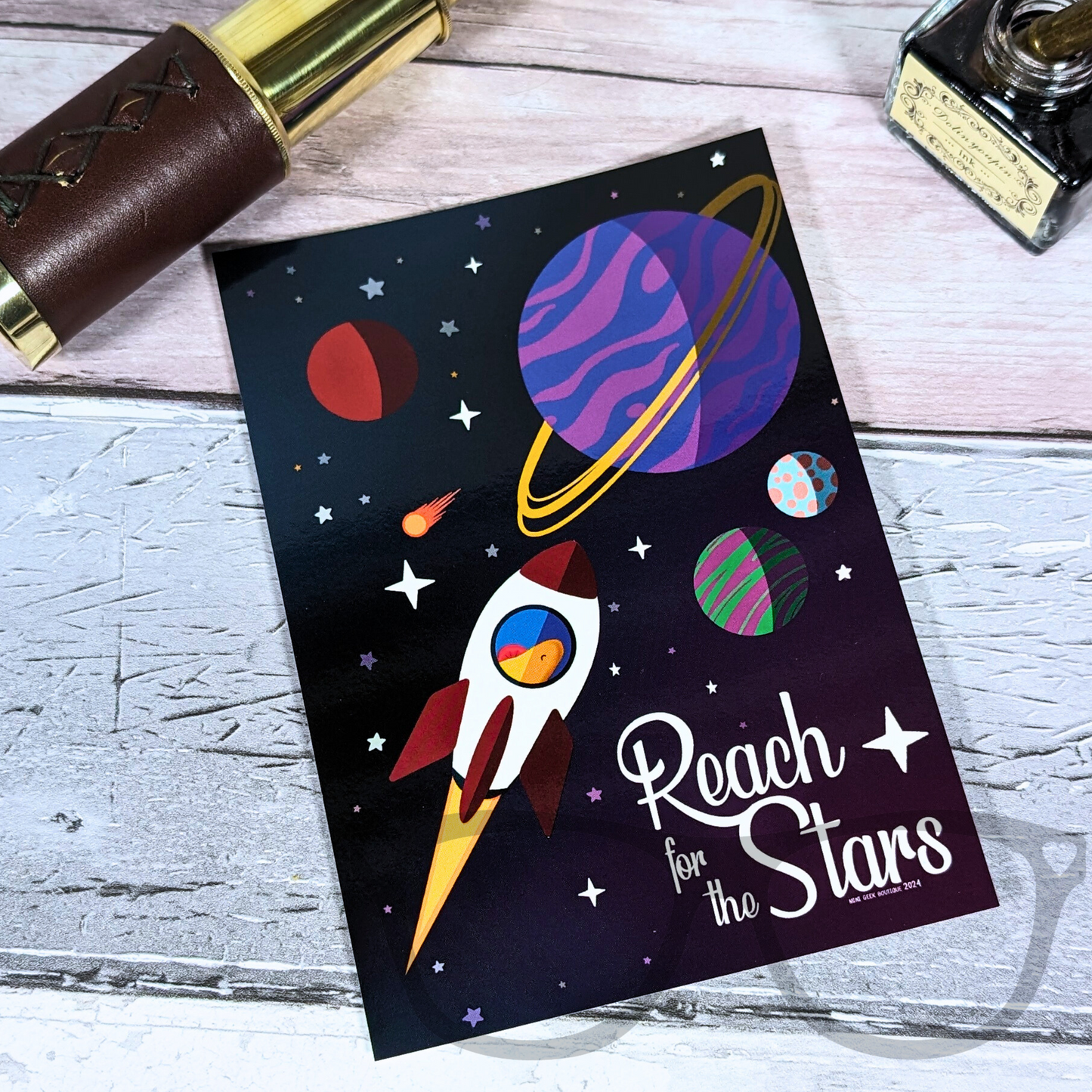 Reach for the stars with this motivational and fun postcards, featuring a digital illustration of Derek flying through space in his rocket.