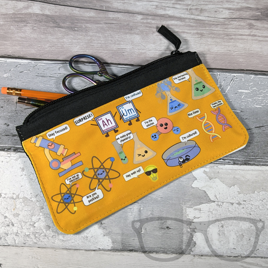 science pencil case with fun little motivational puns shown with  with contents