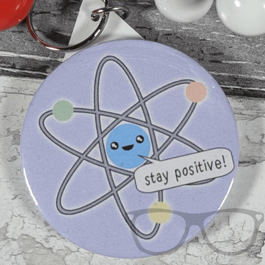 Stay Positive Atom 58mm badge - Mini Geek Boutique