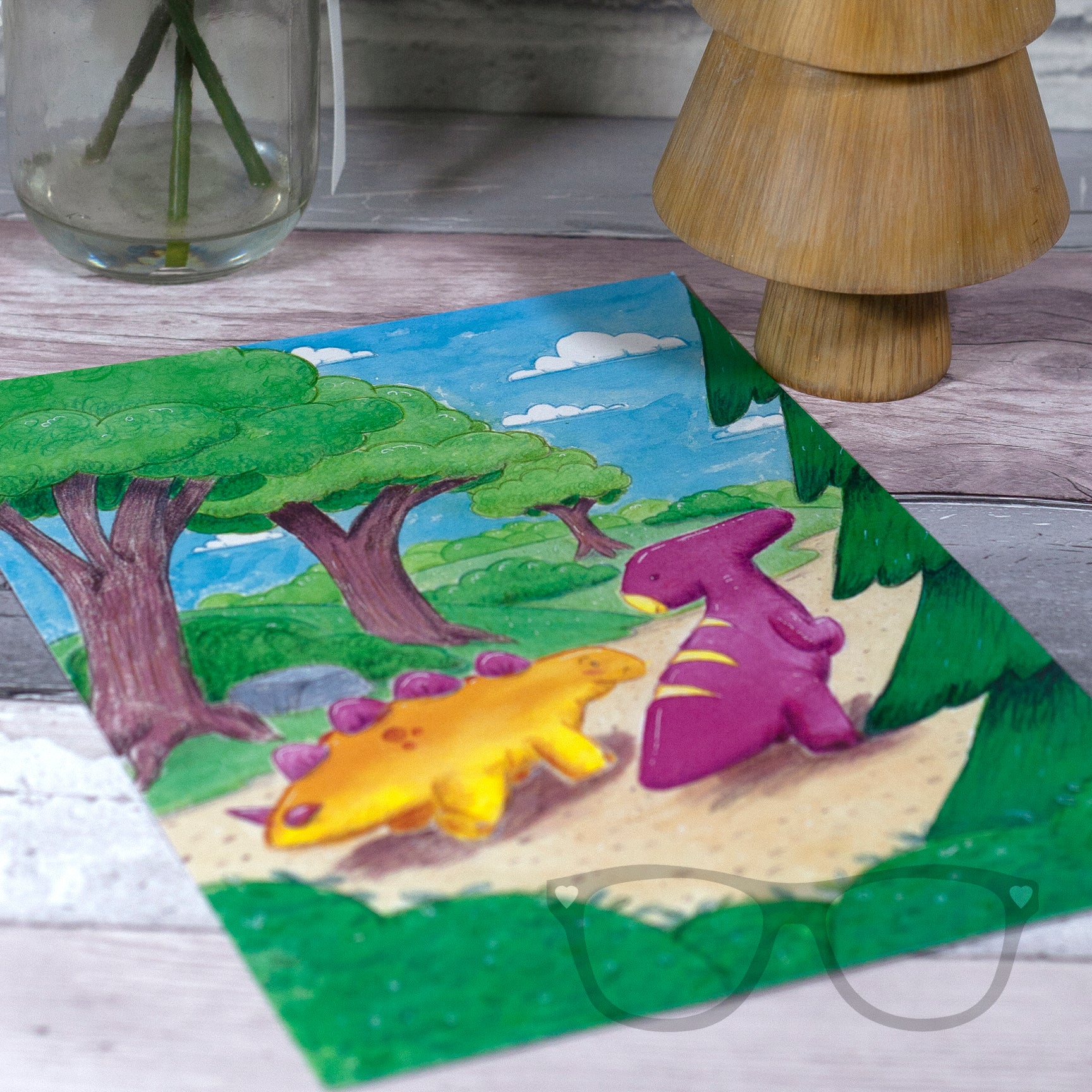 A4-sized dinosaur print with Derek and Irene, the whimsical dinosaurs, walking along a woodland path, designed using vibrant watercolours.