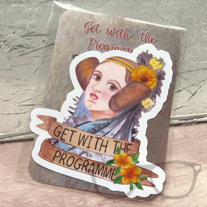 The vinyl sticker of Ada Lovelace is shown in the eco friendly packaging. 
