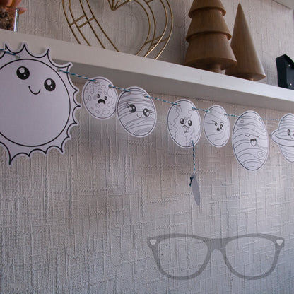 Colour in your own Solar System bunting from Mini Geek Boutique featuring the planets, the sun, and the moon. Includes pencils and twine to hang your artwork.