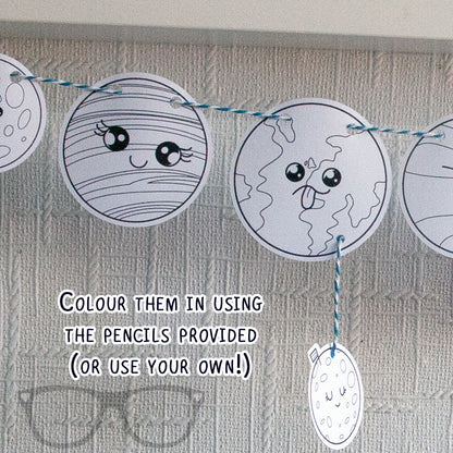 Venus and Earth with Moon dangling, with text 'Colour them in using the pencils provided or use your own!' Perfect for a fun and educational activity for kids.