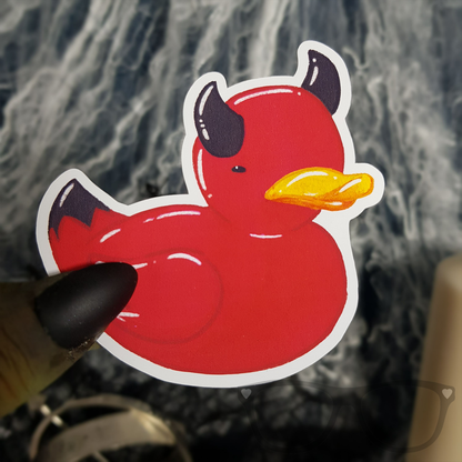 Vinyl sticker showing a red rubber duck with black devil horns