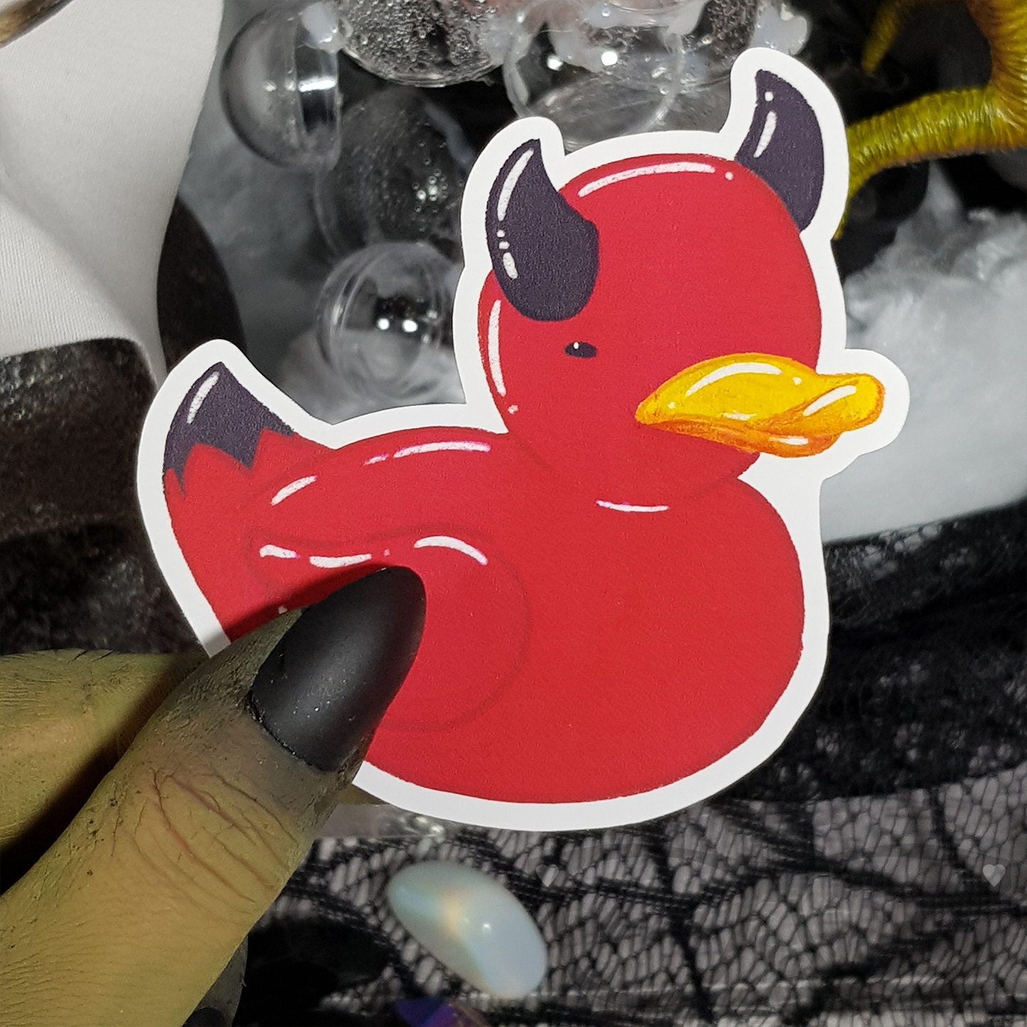 Red rubber ducky with black devil horns vinyl sticker