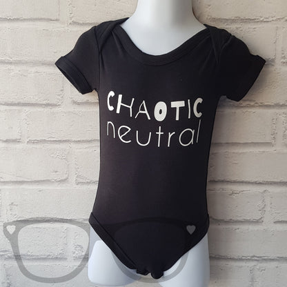 Black baby suit for geeky parents. The white text reads "Chaotic Neutral" by Features a large envelop collar, short sleeves and poppers.