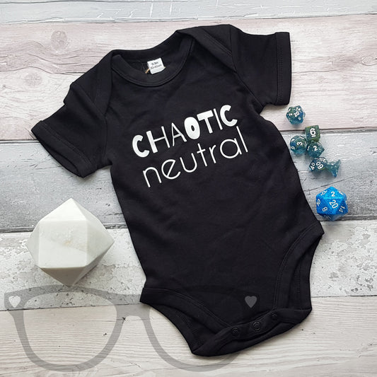 Black baby bodysuit with short sleeves and 'Chaotic Neutral' text on front, featuring envelope collar and popper leg closure for easy changing.
