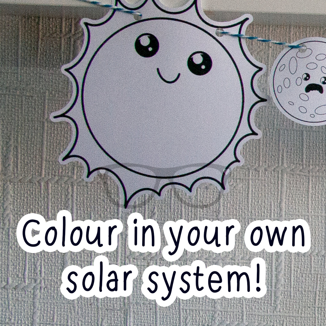 Black and white outline of the sun with the text "Colour in your own solar system!" The kit also includes pencils and string so you can hang up your finished solar system! Great for keeping kids entertained.
